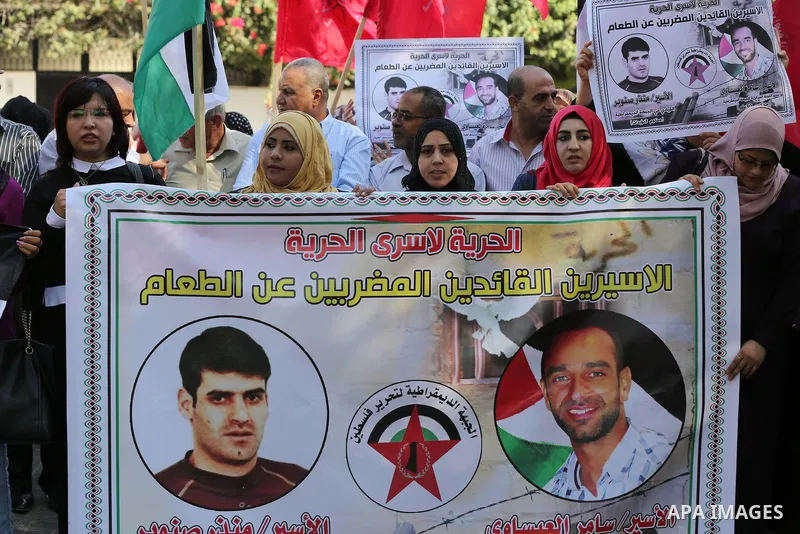 Palestinian supporters of the Popular Front for the Liberation of Palestine (PFLP), take part during a protest to show solidarity with Palestinian prisoners on hunger strike in Israeli Jails, in Gaza city on November 3,...