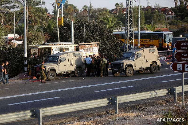 Members of Israeli security forces gather at the site where Israeli troops shot dead a Palestinian who attempted to stab a soldier near the West Bank settlement of Ofra on November 3, 2016. Photo by Shadi Hatem