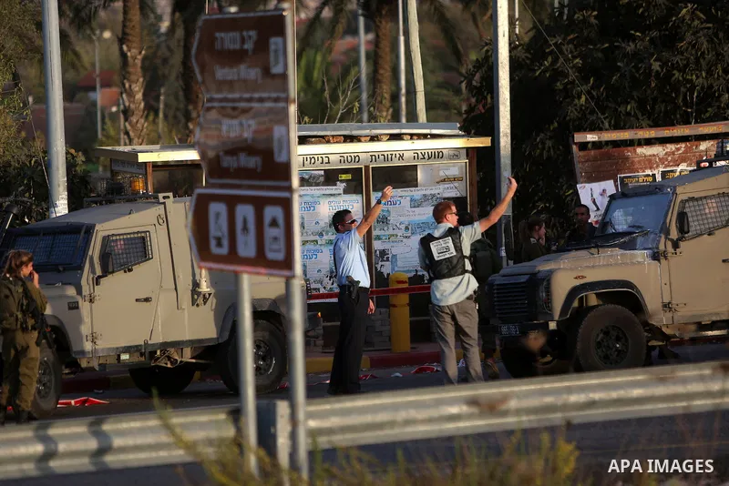 Members of Israeli security forces gather at the site where Israeli troops shot dead a Palestinian who attempted to stab a soldier near the West Bank settlement of Ofra on November 3, 2016. Photo by Shadi Hatem