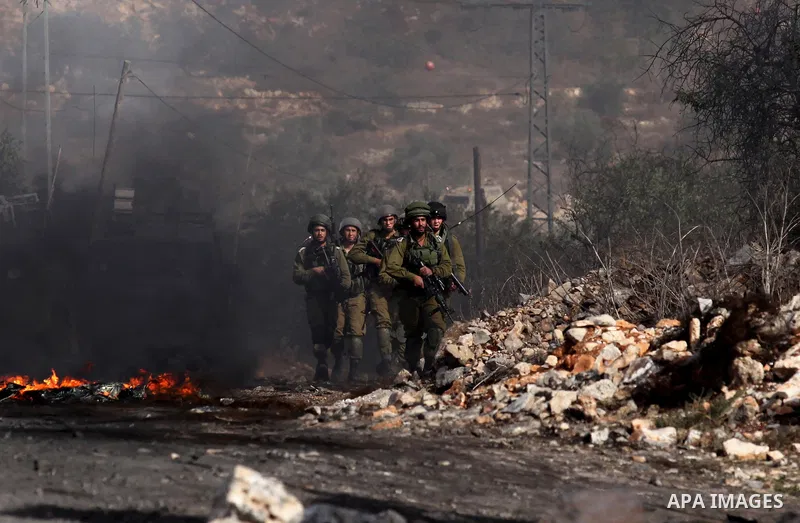 Israeli security forces take position during clashes with Palestinian protesters following a weekly demonstration against the expropriation of Palestinian land by Israel on Nov. 04, 2016, in the village of Kfar Qaddum, n...