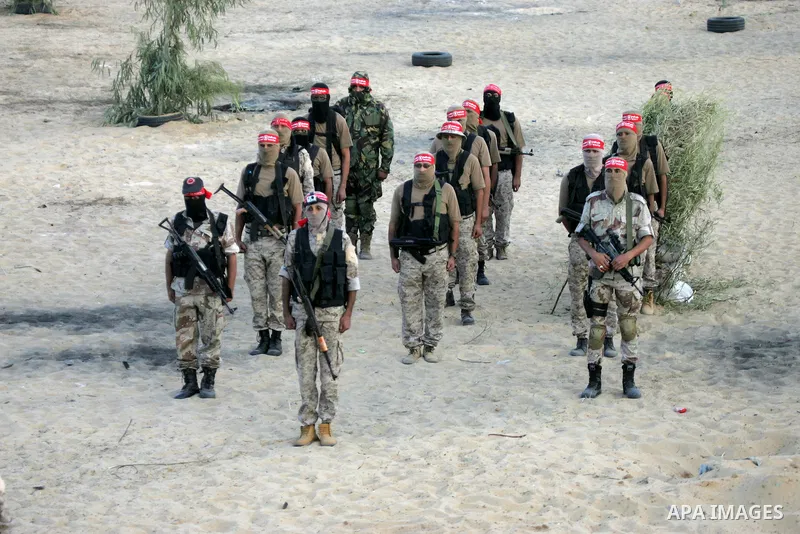 Palestinian militants of the National Resistance brigades, the armed wing of the Democratic Front for the Liberation of Palestine (DFLP), are seen during a graduation ceremony in Rafah, in the southern Gaza Strip, on Nov...