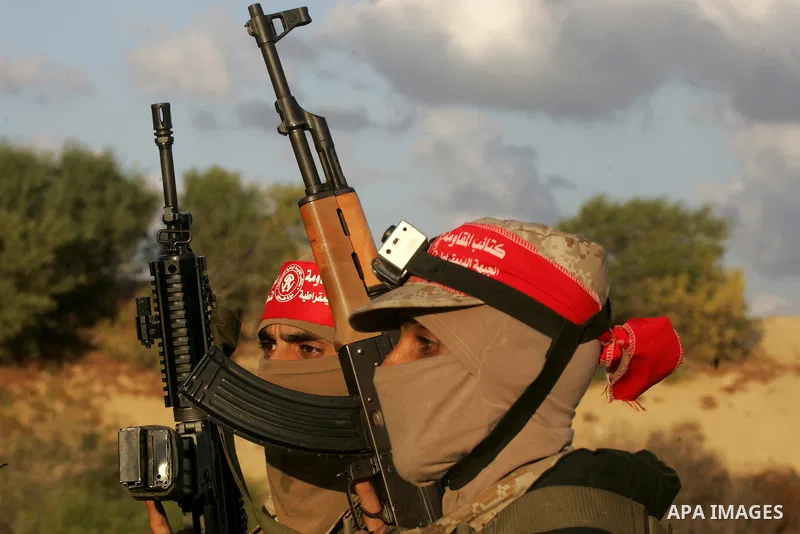 Palestinian militants of the National Resistance brigades, the armed wing of the Democratic Front for the Liberation of Palestine (DFLP), are seen during a graduation ceremony in Rafah, in the southern Gaza Strip, on Nov...