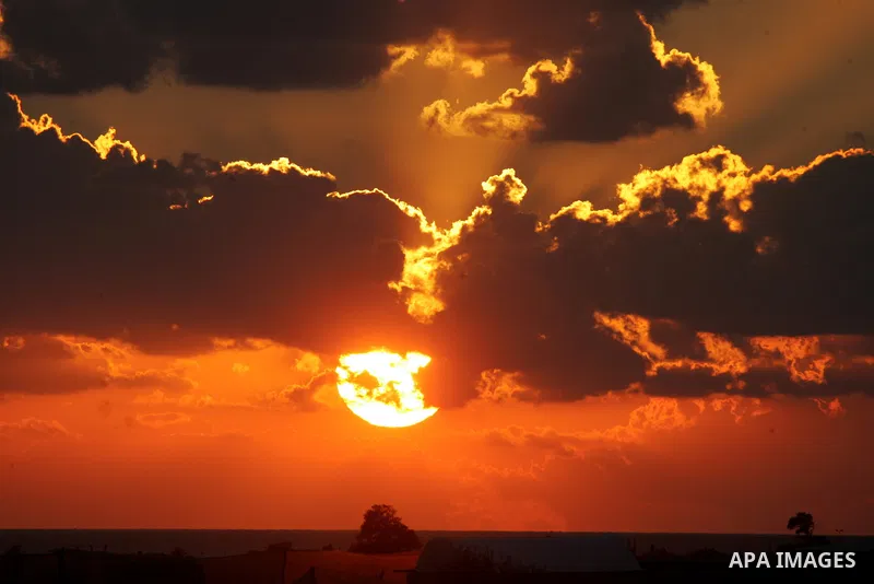 The sunset are seen above Rafah, in the southern Gaza Strip, on November 4, 2016. Photo by Abed Rahim Khatib