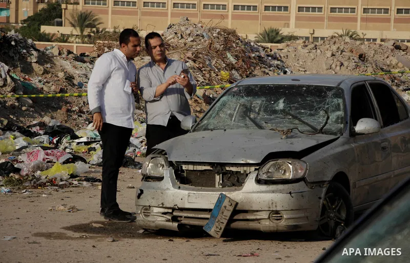 Egyptian police inspect the blast scene in Cairo's eastern district of Naser City, Egypt, on Nov. 4, 2016. An Egyptian judge escaped a car explosion in Cairo's eastern district of Naser City on Friday, the judge was not...