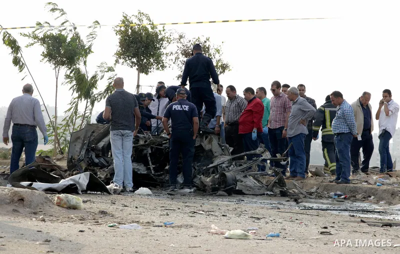 Egyptian police inspect the blast scene in Cairo's eastern district of Naser City, Egypt, on Nov. 4, 2016. An Egyptian judge escaped a car explosion in Cairo's eastern district of Naser City on Friday, the judge was not...