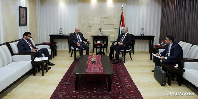 Palestinian Prime Minister Rami Hamdallah meets with Qatar's Ambassador to the Palestinian Authority, Mohammed Al Emadi in the West Bank city of Ramallah, on Nov. 06, 2016. Photo by Prime Minister Office