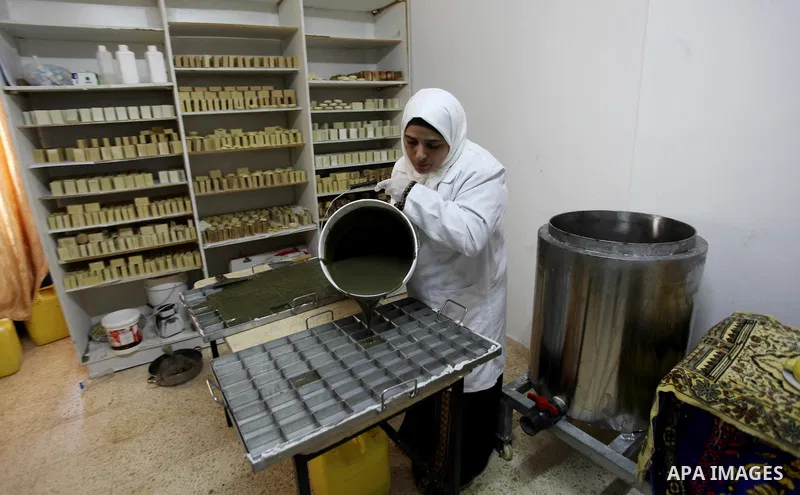 A Palestinian woman Howaida Abu yaqub ,40, prepares the natural soaps from natural raw materials olive oil, honey, goat's milk at her small workshop, in the West Bank city of Nablus, on November 7, 2016. Photo by Nedal E...
