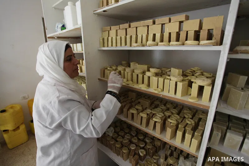 A Palestinian woman Howaida Abu yaqub ,40, prepares the natural soaps from natural raw materials olive oil, honey, goat's milk at her small workshop, in the West Bank city of Nablus, on November 7, 2016. Photo by Nedal E...