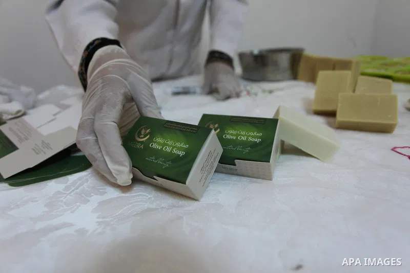 A Palestinian woman Howaida Abu yaqub ,40, prepares the natural soaps from natural raw materials olive oil, honey, goat's milk at her small workshop, in the West Bank city of Nablus, on November 7, 2016. Photo by Nedal E...