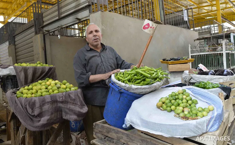 Egyptians shop at a market in Cairo, Egypt, on November 7, 2016. Photo by Amr Sayed