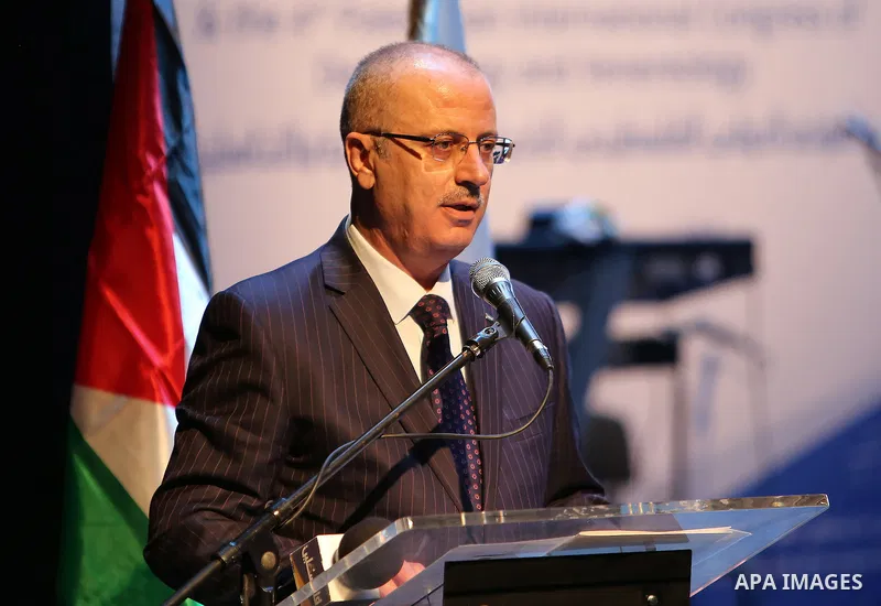 Palestinian Prime Minister Rami Hamdallah speaks during the opening of 15th international conference of Skin doctors, in the West Bank city of Ramallah, on Nov. 08, 2016. Photo by Prime Minister Office