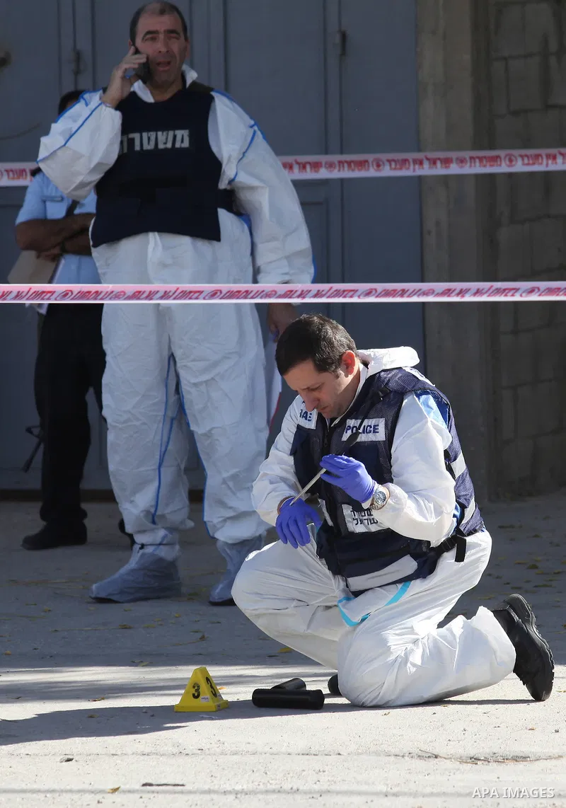 Israeli security forces search the scene where the Israeli military said a Palestinian stabbed a soldier with screwdriver before he was shot, in the West Bank village of Hawara near Nablus, November 9, 2016. Photo by Ned...