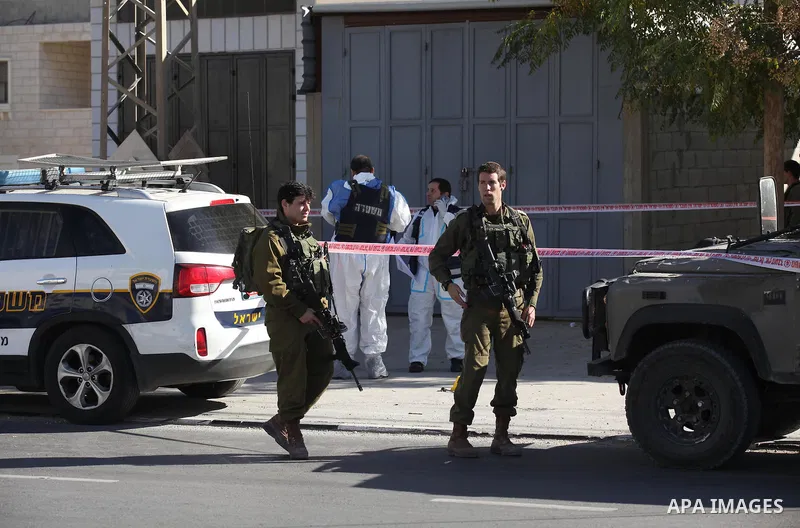 Israeli security forces search the scene where the Israeli military said a Palestinian stabbed a soldier with screwdriver before he was shot, in the West Bank village of Hawara near Nablus, November 9, 2016. Photo by Ned...