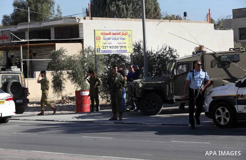 Israeli security forces search the scene where the Israeli military said a Palestinian stabbed a soldier with screwdriver before he was shot, in the West Bank village of Hawara near Nablus, November 9, 2016. Photo by Ned...
