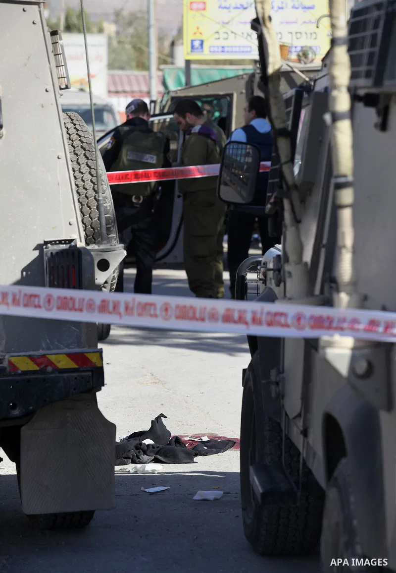 Israeli security forces search the scene where the Israeli military said a Palestinian stabbed a soldier with screwdriver before he was shot, in the West Bank village of Hawara near Nablus, November 9, 2016. Photo by Ned...