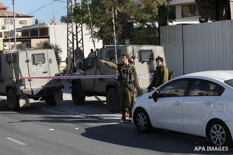 Israeli security forces search the scene where the Israeli military said a Palestinian stabbed a soldier with screwdriver before he was shot, in the West Bank village of Hawara near Nablus, November 9, 2016. Photo by Ned...