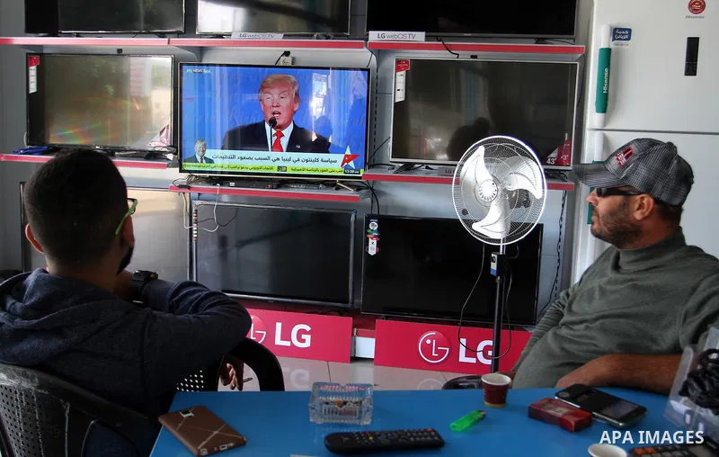 Palestinians watch Donald Trump's victory speech on TV in Rahaf in the southern Gaza strip, on November 9, 2016. U.S. Republican Donald Trump has been elected the 45th president of the United States after defeated his De...