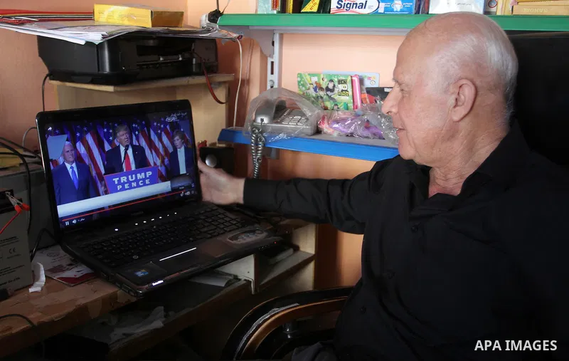 A Palestinian man watches Donald Trump's victory speech on TV in Rahaf in the southern Gaza strip, on November 9, 2016. U.S. Republican Donald Trump has been elected the 45th president of the United States after defeated...