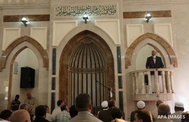 Senior Hamas leader Khalil al-Hayah attends Friday prayers at al- Aeshlah mosque which was destroyed during the 50-day war between Israel and Hamas militants in the summer of 2014, in Shajaiyeh neighborhood in Gaza city,...
