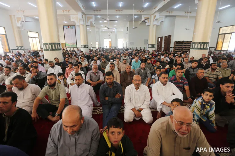 Palestinian Muslim worshippers perform Friday prayers at al- Ashlah mosque which was destroyed during the 50-day war between Israel and Hamas militants in the summer of 2014, in Shajaiyeh neighborhood in Gaza city, after...