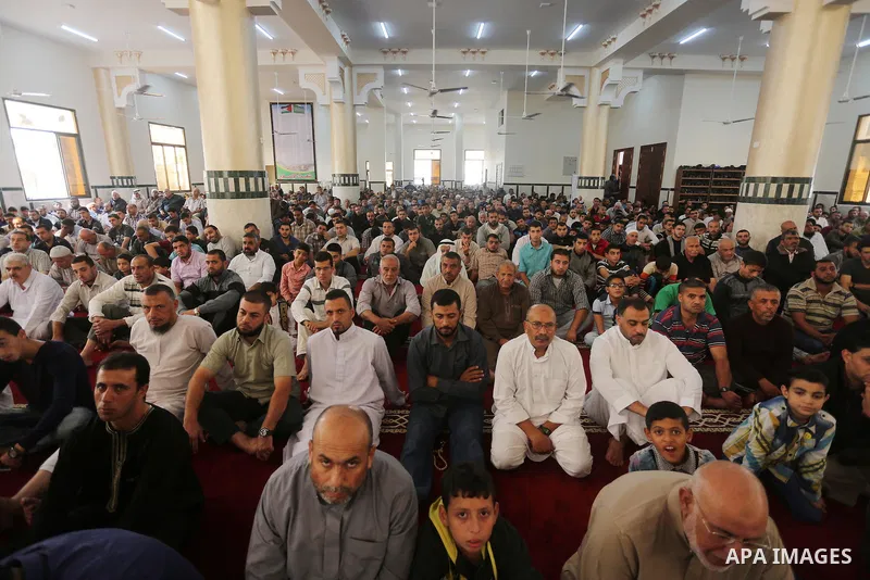 Palestinian Muslim worshippers perform Friday prayers at al- Ashlah mosque which was destroyed during the 50-day war between Israel and Hamas militants in the summer of 2014, in Shajaiyeh neighborhood in Gaza city, after...