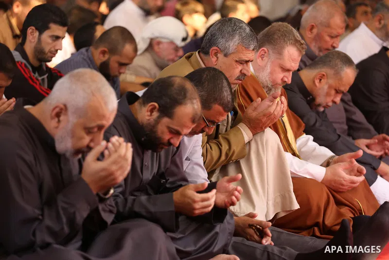 Palestinian Muslim worshippers perform Friday prayers at al- Ashlah mosque which was destroyed during the 50-day war between Israel and Hamas militants in the summer of 2014, in Shajaiyeh neighborhood in Gaza city, after...