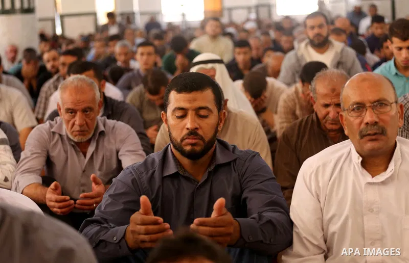 Palestinian Muslim worshippers perform Friday prayers at al- Ashlah mosque which was destroyed during the 50-day war between Israel and Hamas militants in the summer of 2014, in Shajaiyeh neighborhood in Gaza city, after...