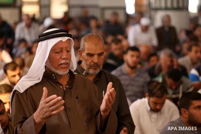 Palestinian Muslim worshippers perform Friday prayers at al- Ashlah mosque which was destroyed during the 50-day war between Israel and Hamas militants in the summer of 2014, in Shajaiyeh neighborhood in Gaza city, after...