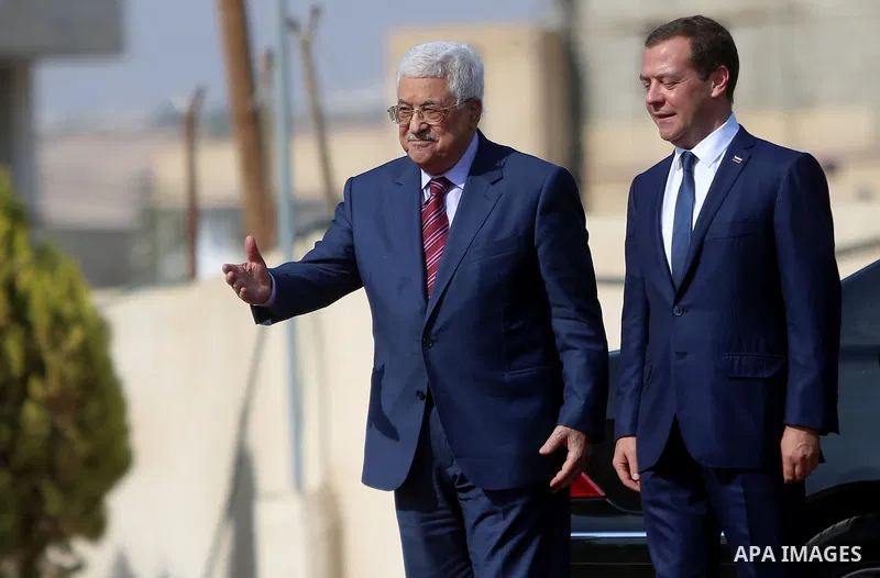 Palestinian President Mahmud Abbas and Russian Prime Minister Dmitry Medvedev arrive for a meeting in the West Bank city of Jericho, on November 11, 2016. Photo by Shadi Hatem