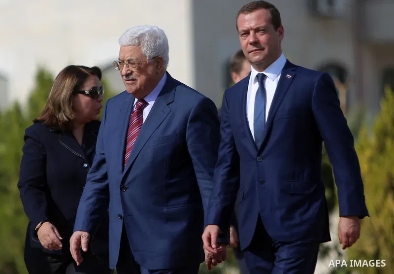 Palestinian President Mahmud Abbas and Russian Prime Minister Dmitry Medvedev arrive for a meeting in the West Bank city of Jericho, on November 11, 2016. Photo by Shadi Hatem