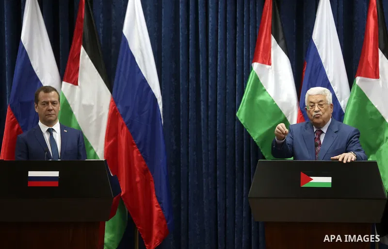 Palestinian President Mahmoud Abbas and Russian Prime Minister Dmitry Medvedev attend a joint news conference in the West Bank city of Jericho November 11, 2016. Photo by Shadi Hatem