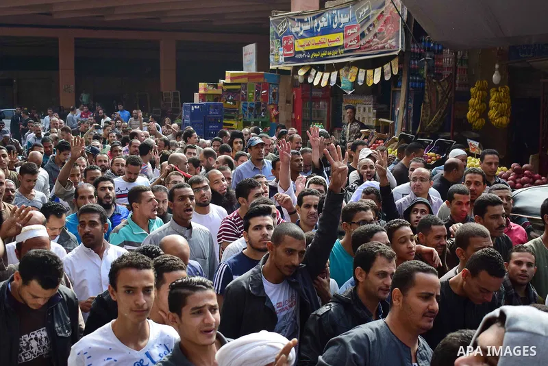 Egyptian supporters of ousted Islamist president Mohammed Morsi and the Muslim Brotherhood, march shouting slogans against the President Abdel Fattah al-Sisi and the military rule in al-Haram neighbourhood in the souther...