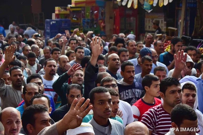 Egyptian supporters of ousted Islamist president Mohammed Morsi and the Muslim Brotherhood, march shouting slogans against the President Abdel Fattah al-Sisi and the military rule in al-Haram neighbourhood in the souther...