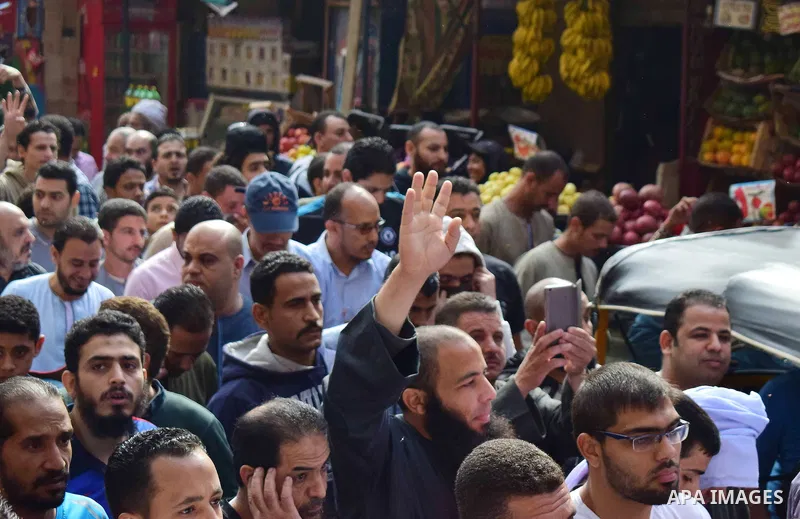 Egyptian supporters of ousted Islamist president Mohammed Morsi and the Muslim Brotherhood, march shouting slogans against the President Abdel Fattah al-Sisi and the military rule in al-Haram neighbourhood in the souther...