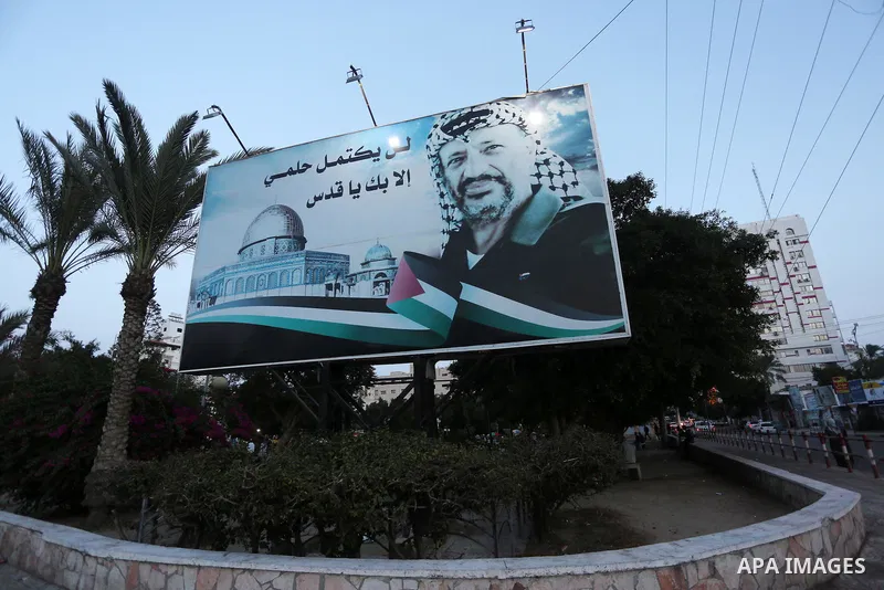 A Picture taken on November 11, 2016 shows a poster of the late Palestinian leader Yasser Arafat, on the 12 anniversary of his death in Gaza city. Photo by Mohammed Asad