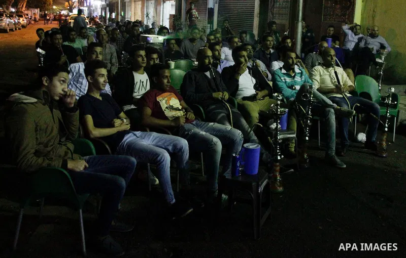 Egyptian fans watch the televised the 2018 World Cup qualifying Group E football match between Egypt and Ghana, in Cairo, Egypt on November 13, 2016. Photo by Stringer