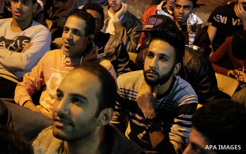 Egyptian fans watch the televised the 2018 World Cup qualifying Group E football match between Egypt and Ghana, in Cairo, Egypt on November 13, 2016. Photo by Stringer