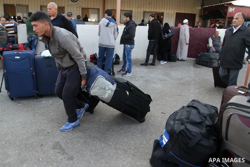 Palestinians wait permission to enter Egypt as they gather at the Rafah border crossing in the southern Gaza Strip on on November 14, 2016. Egypt is due to reopen its Rafah border crossing with Gaza for Five days. Photo...