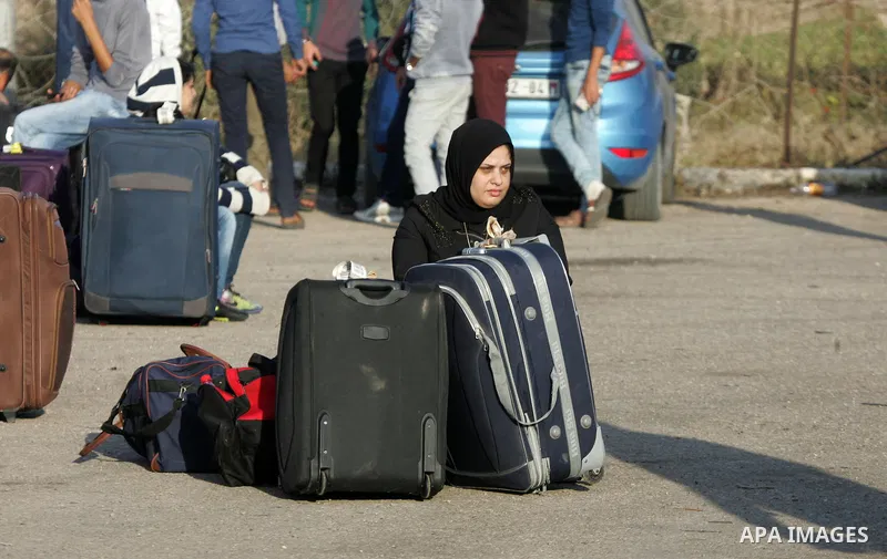 Palestinians wait permission to enter Egypt as they gather at the Rafah border crossing in the southern Gaza Strip on on November 14, 2016. Egypt is due to reopen its Rafah border crossing with Gaza for Five days. Photo...