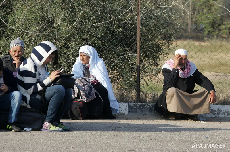 Palestinians wait permission to enter Egypt as they gather at the Rafah border crossing in the southern Gaza Strip on on November 14, 2016. Egypt is due to reopen its Rafah border crossing with Gaza for Five days. Photo...