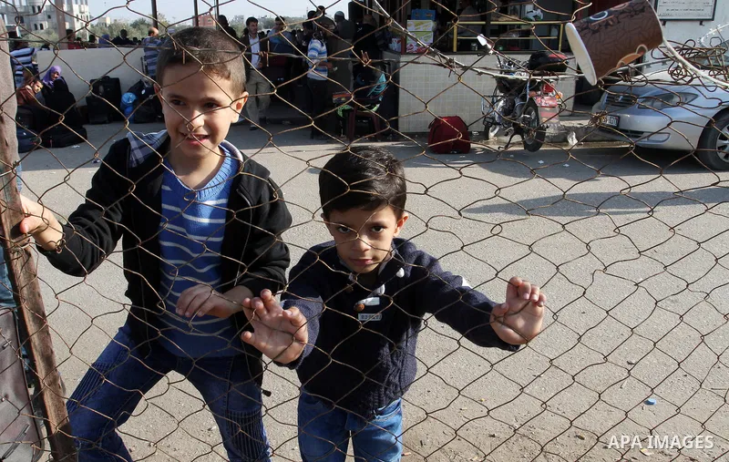 Palestinians wait permission to enter Egypt as they gather at the Rafah border crossing in the southern Gaza Strip on on November 14, 2016. Egypt is due to reopen its Rafah border crossing with Gaza for Five days. Photo...