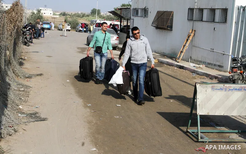Palestinians wait permission to enter Egypt as they gather at the Rafah border crossing in the southern Gaza Strip on on November 14, 2016. Egypt is due to reopen its Rafah border crossing with Gaza for Five days. Photo...
