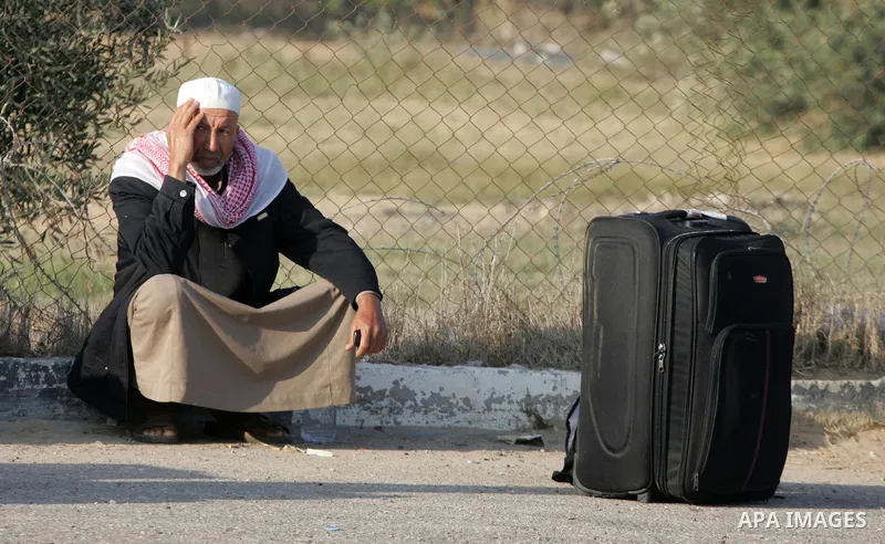 Palestinians wait permission to enter Egypt as they gather at the Rafah border crossing in the southern Gaza Strip on on November 14, 2016. Egypt is due to reopen its Rafah border crossing with Gaza for Five days. Photo...