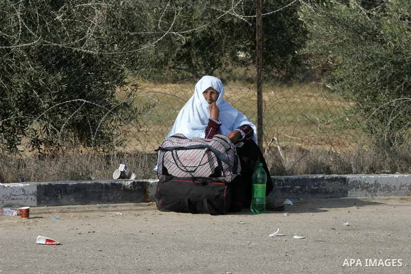 Palestinians wait permission to enter Egypt as they gather at the Rafah border crossing in the southern Gaza Strip on on November 14, 2016. Egypt is due to reopen its Rafah border crossing with Gaza for Five days. Photo...