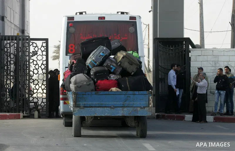 Palestinians wait permission to enter Egypt as they gather at the Rafah border crossing in the southern Gaza Strip on on November 14, 2016. Egypt is due to reopen its Rafah border crossing with Gaza for Five days. Photo...
