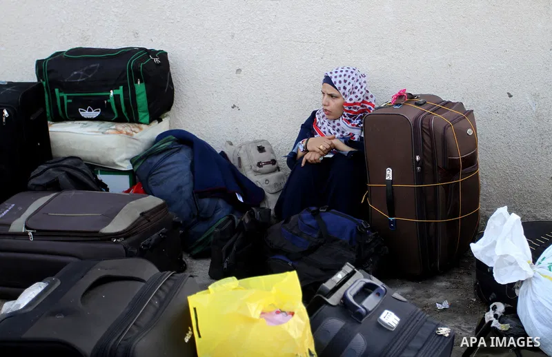 Palestinians wait permission to enter Egypt as they gather at the Rafah border crossing in the southern Gaza Strip on on November 14, 2016. Egypt is due to reopen its Rafah border crossing with Gaza for Five days. Photo...