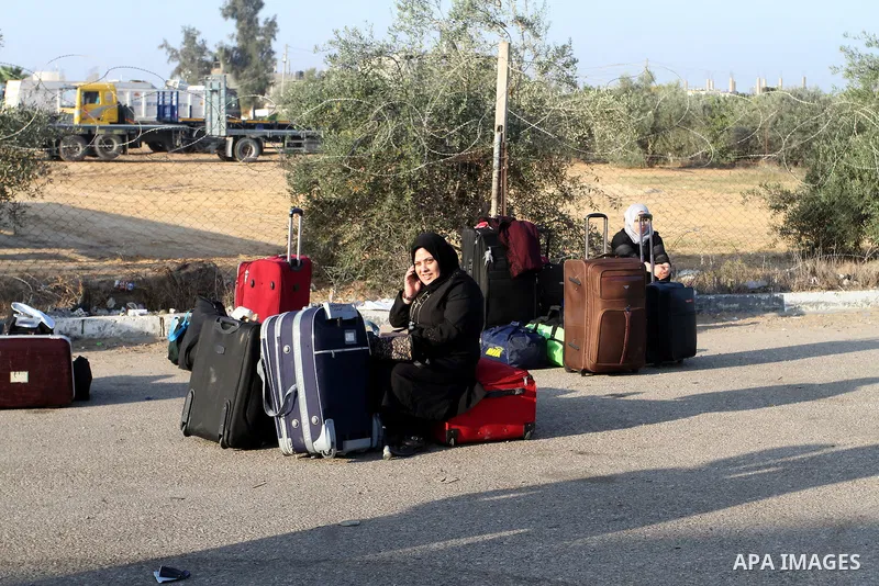 Palestinians wait permission to enter Egypt as they gather at the Rafah border crossing in the southern Gaza Strip on on November 14, 2016. Egypt is due to reopen its Rafah border crossing with Gaza for Five days. Photo...