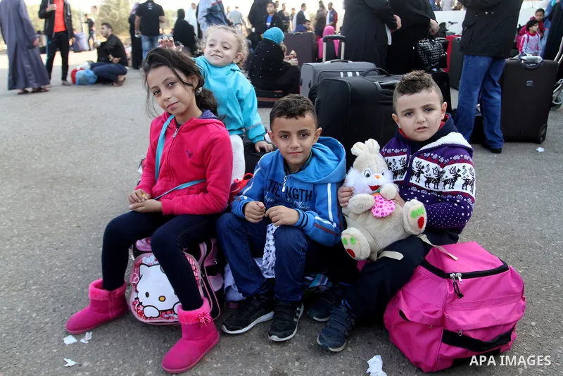 Palestinians wait permission to enter Egypt as they gather at the Rafah border crossing in the southern Gaza Strip on on November 14, 2016. Egypt is due to reopen its Rafah border crossing with Gaza for Five days. Photo...