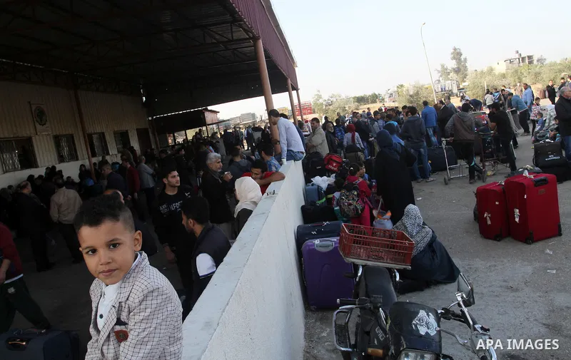 Palestinians wait permission to enter Egypt as they gather at the Rafah border crossing in the southern Gaza Strip on on November 14, 2016. Egypt is due to reopen its Rafah border crossing with Gaza for Five days. Photo...