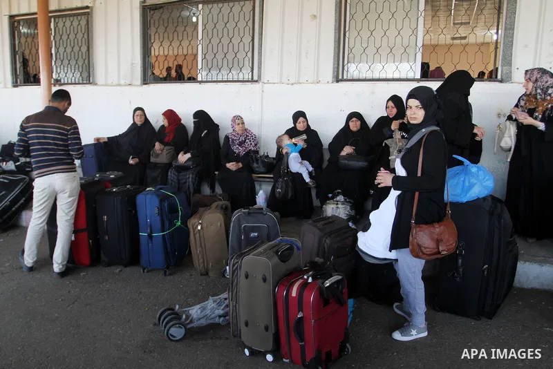 Palestinians wait permission to enter Egypt as they gather at the Rafah border crossing in the southern Gaza Strip on on November 14, 2016. Egypt is due to reopen its Rafah border crossing with Gaza for Five days. Photo...